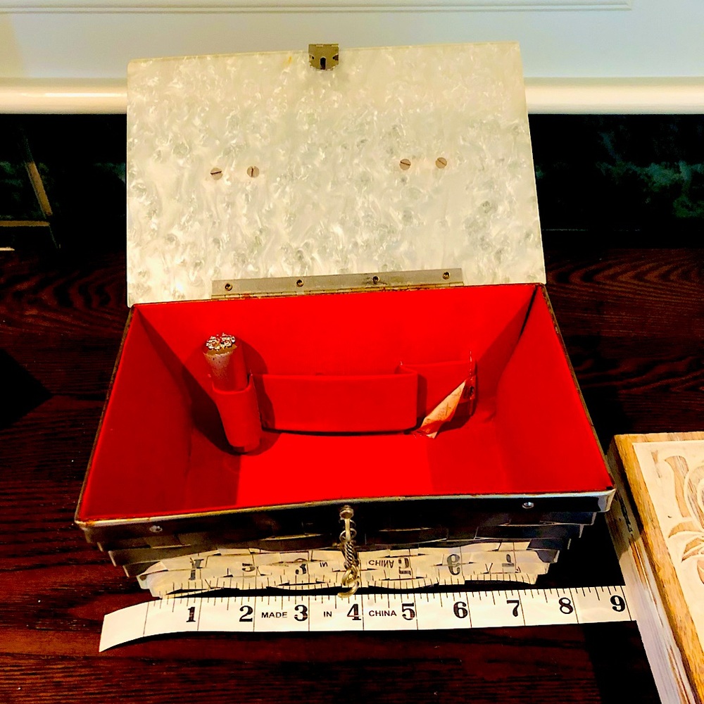 Vintage lucite purse. Metal weaved design with marble/opal lid and red interior